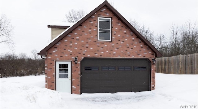 view of snow covered garage