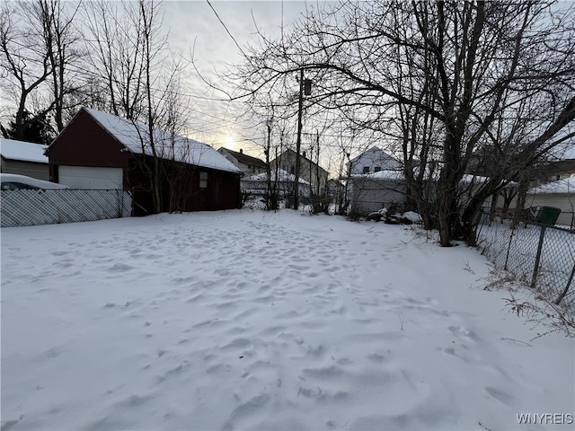 view of yard layered in snow