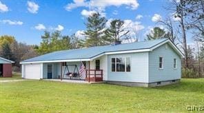 view of front of home with a garage and a front yard