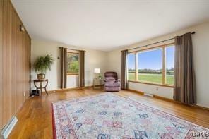 unfurnished room with hardwood / wood-style floors and a wealth of natural light