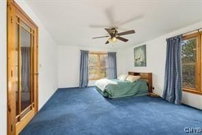 carpeted bedroom with ceiling fan