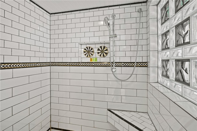 bathroom with tiled shower