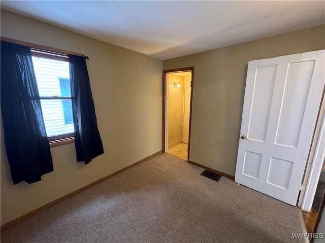 unfurnished bedroom with carpet flooring