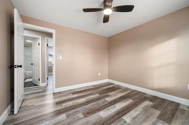 empty room with hardwood / wood-style floors