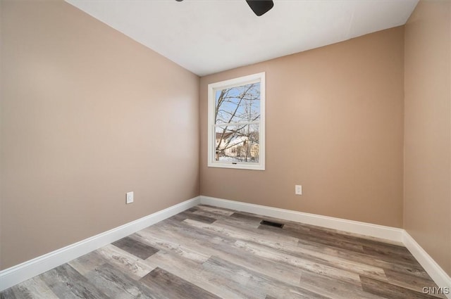 unfurnished room with light hardwood / wood-style floors