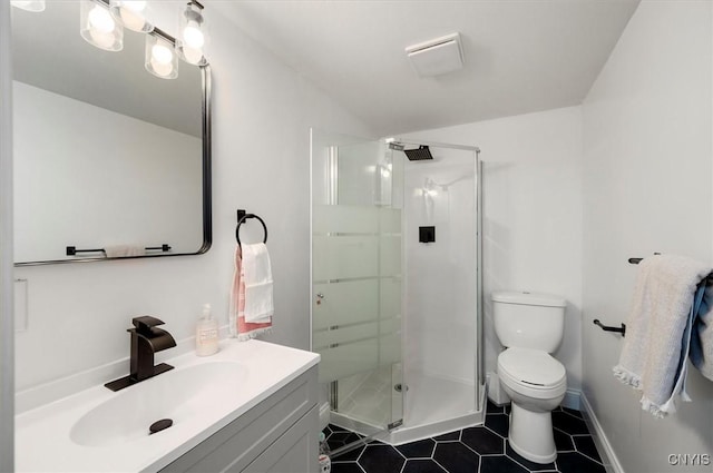 bathroom with vaulted ceiling, tile patterned flooring, vanity, a shower with shower door, and toilet