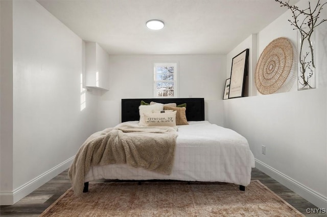 bedroom with hardwood / wood-style flooring