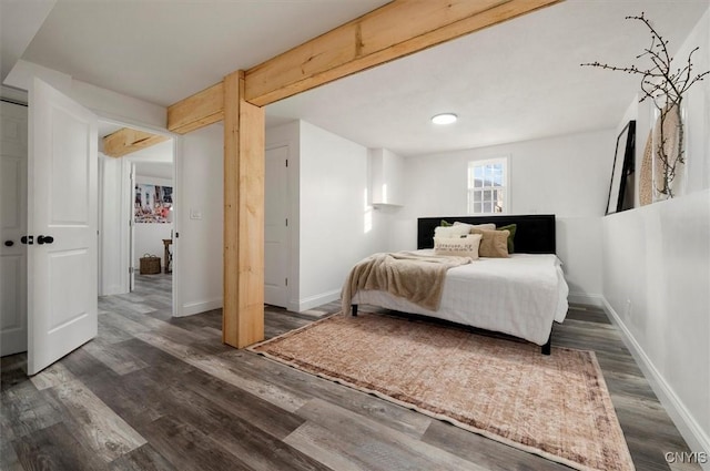 bedroom featuring dark hardwood / wood-style flooring