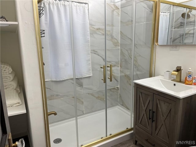 bathroom with vanity and an enclosed shower