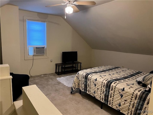 carpeted bedroom featuring cooling unit, vaulted ceiling, and ceiling fan