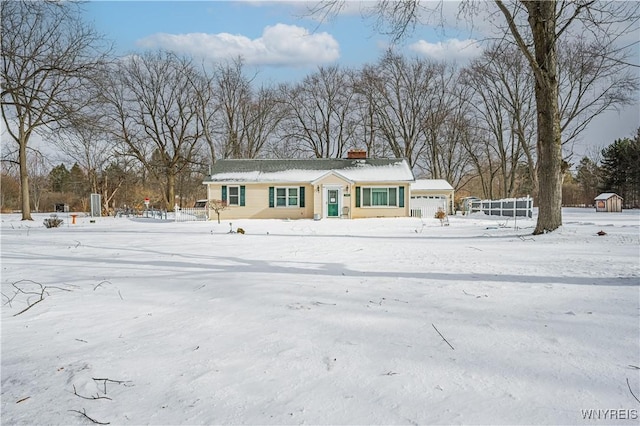 single story home featuring a garage