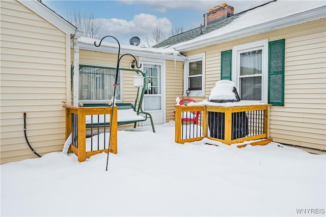 view of snow covered deck