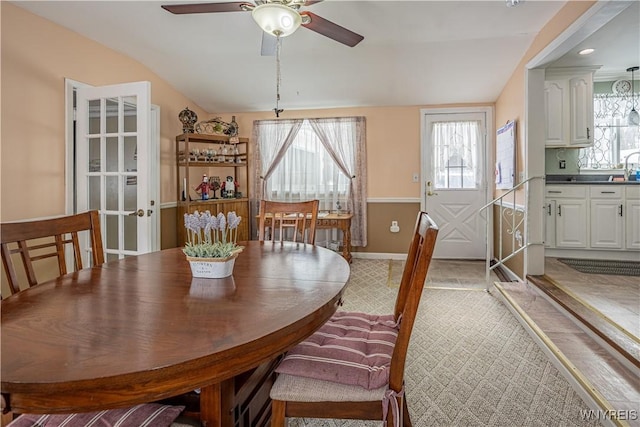 dining area with ceiling fan, sink, and a healthy amount of sunlight