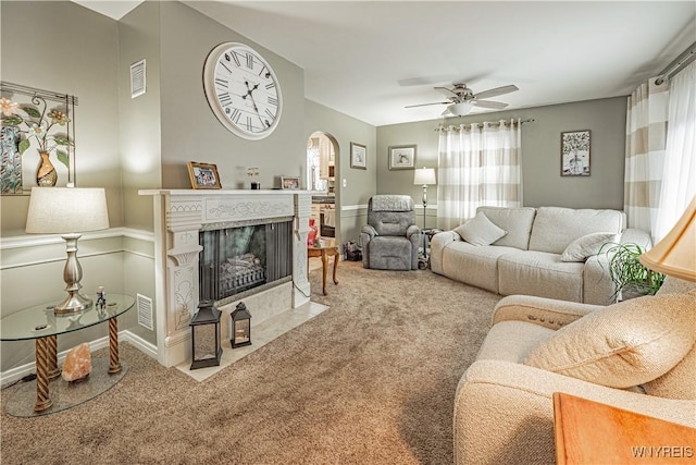 living room with carpet floors and ceiling fan