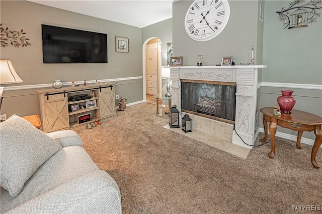 carpeted living room with a fireplace