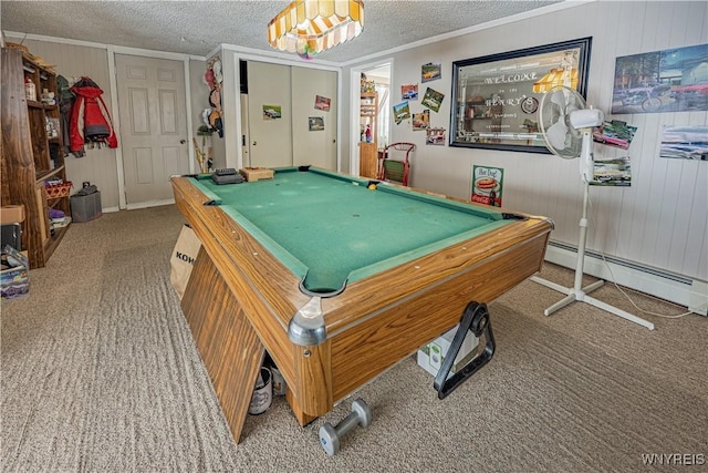 playroom with a baseboard heating unit, crown molding, a textured ceiling, and carpet