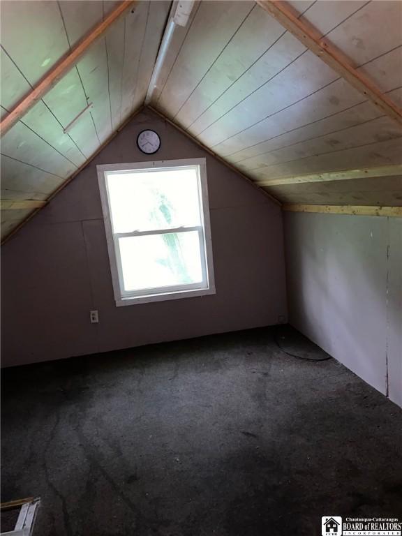 bonus room featuring carpet, wooden ceiling, and lofted ceiling