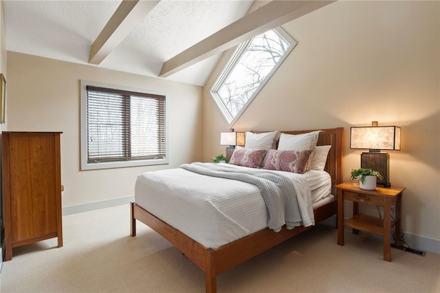 carpeted bedroom with lofted ceiling with beams and a textured ceiling