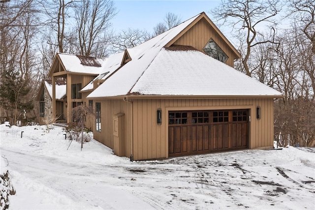 view of snow covered garage