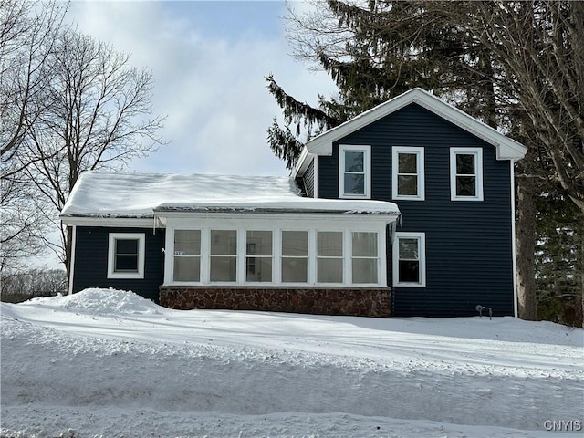 exterior space featuring a sunroom