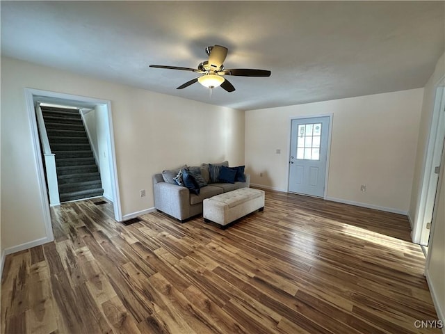 unfurnished room with dark hardwood / wood-style floors and ceiling fan