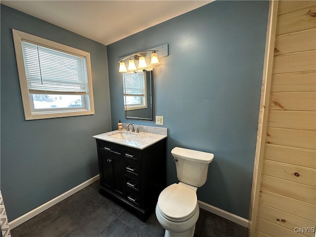 bathroom featuring vanity, toilet, and tile patterned flooring