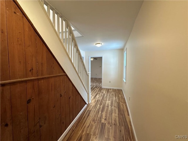 corridor with hardwood / wood-style flooring