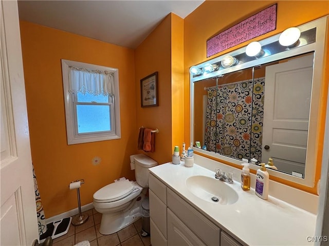 bathroom with vanity, tile patterned floors, and toilet