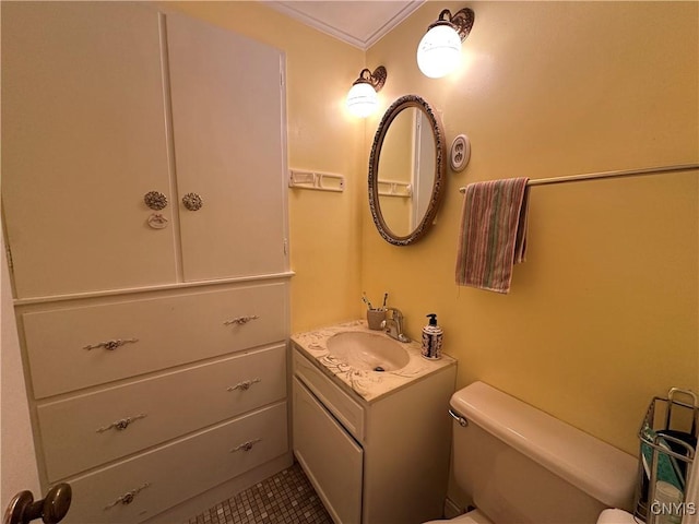 bathroom featuring vanity, tile patterned floors, and toilet