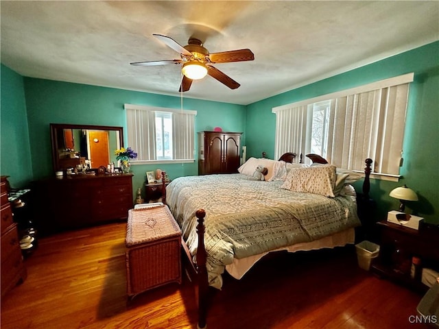 bedroom featuring ceiling fan and hardwood / wood-style floors