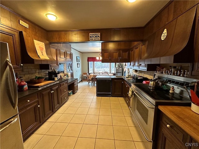 kitchen with backsplash, stainless steel appliances, ornamental molding, light tile patterned flooring, and kitchen peninsula