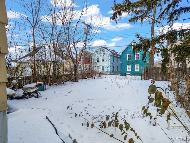 view of yard layered in snow