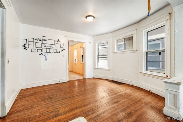 empty room featuring hardwood / wood-style flooring