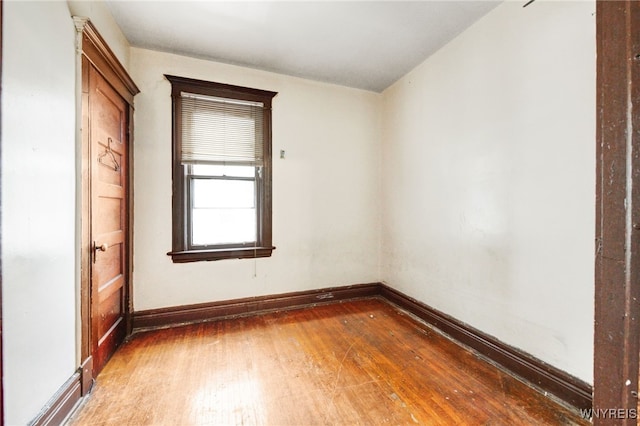 spare room with hardwood / wood-style flooring