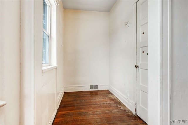 empty room featuring dark wood-type flooring