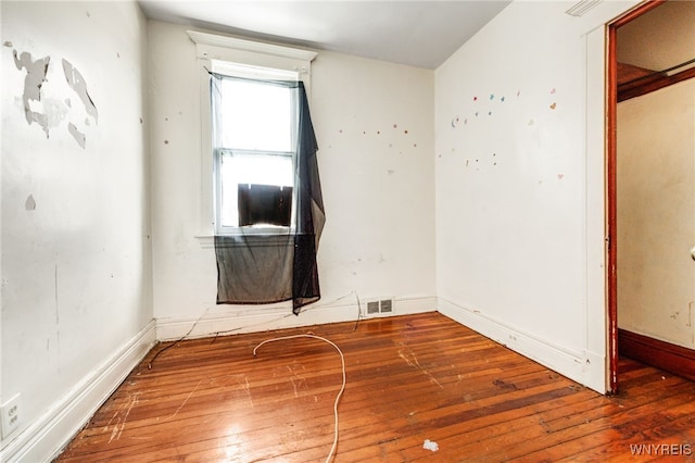 spare room featuring hardwood / wood-style flooring