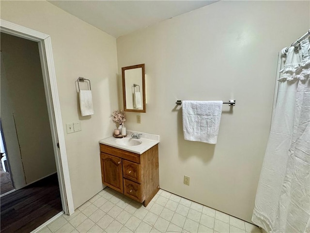 bathroom with vanity and tile patterned flooring