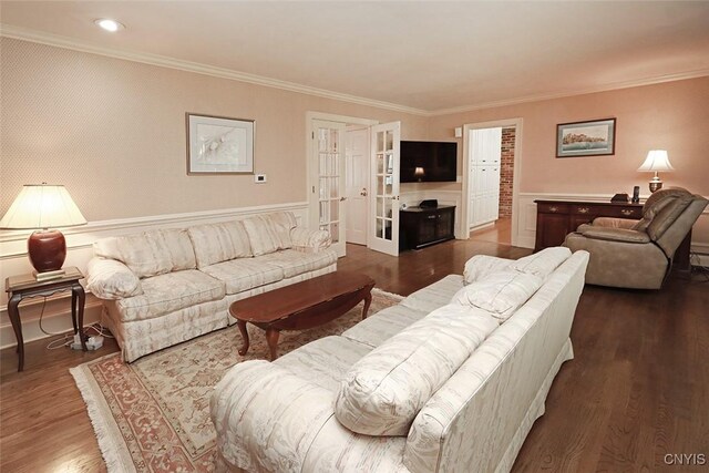 living room with ornamental molding, dark hardwood / wood-style floors, and french doors