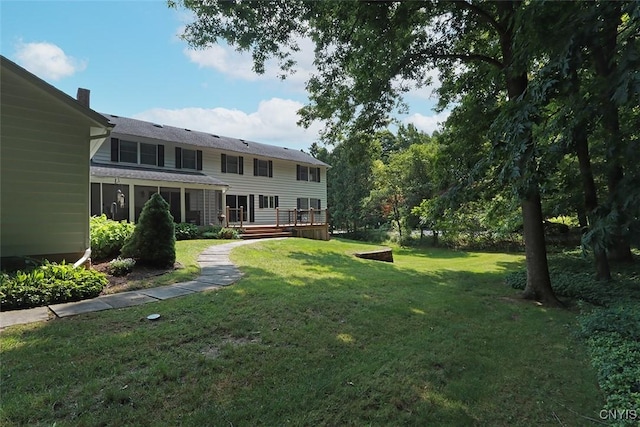 view of yard with a wooden deck