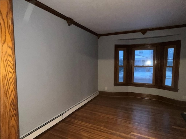 empty room with crown molding, dark wood-type flooring, and a baseboard radiator