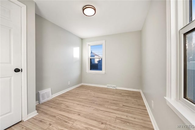 spare room featuring light hardwood / wood-style floors