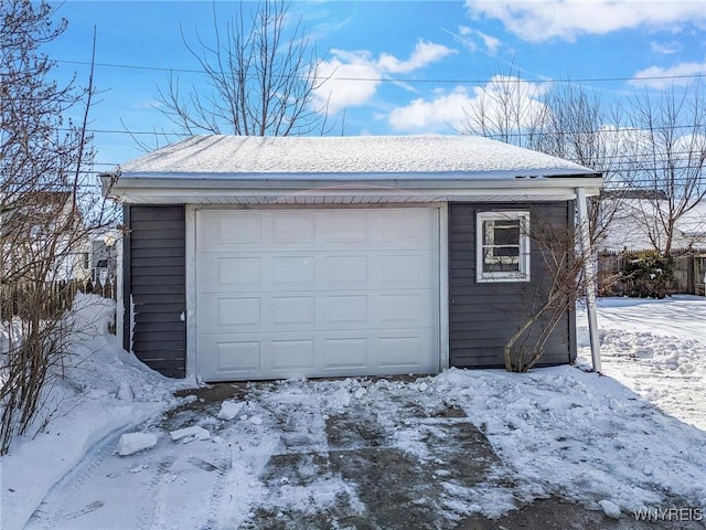 view of snow covered garage