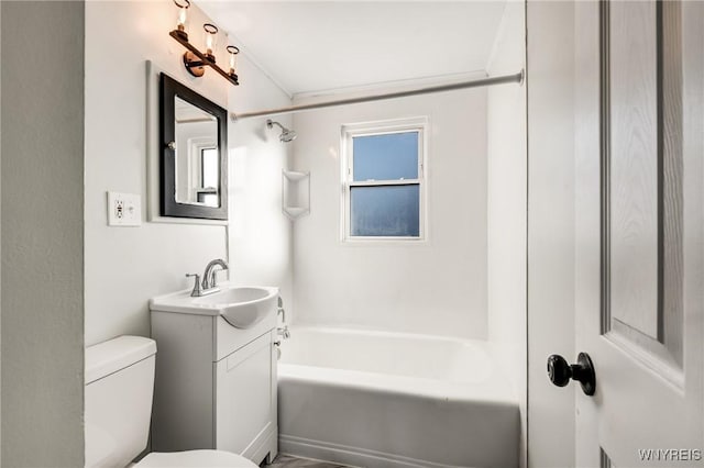 full bathroom with vanity, tub / shower combination, and toilet