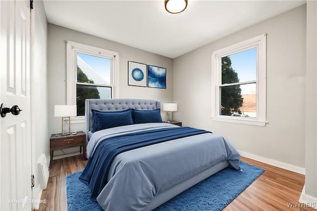 bedroom with wood-type flooring