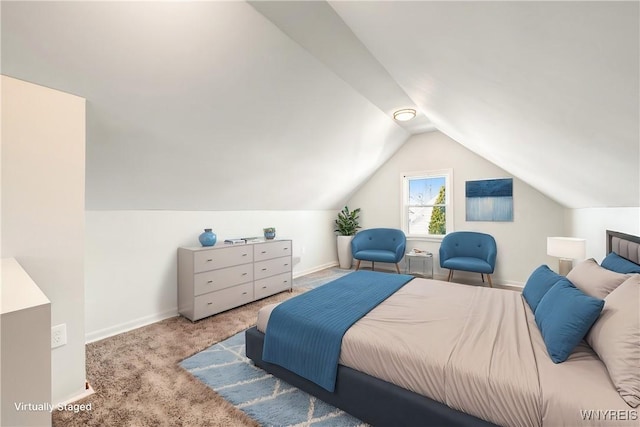 carpeted bedroom with vaulted ceiling