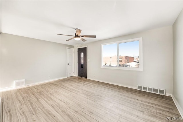 unfurnished room featuring ceiling fan and light hardwood / wood-style flooring