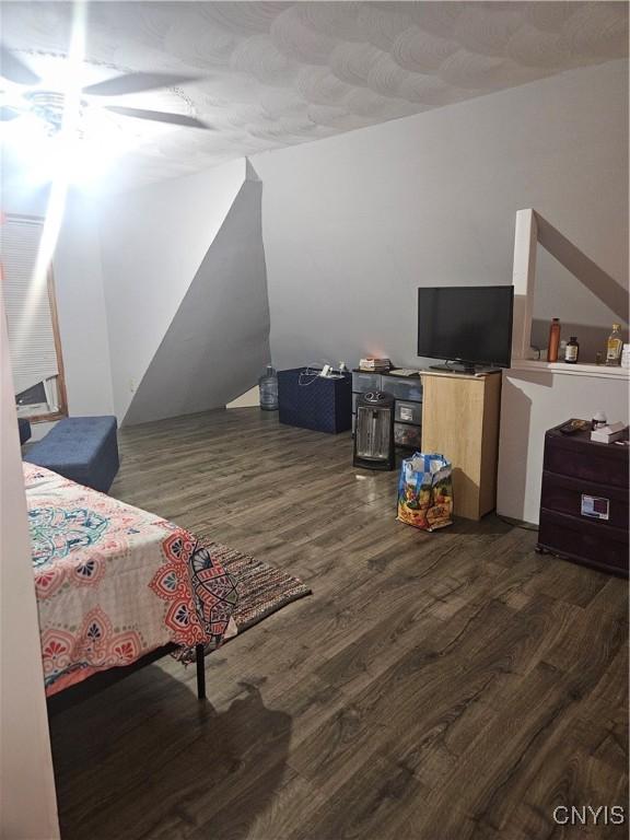 bedroom featuring dark hardwood / wood-style flooring