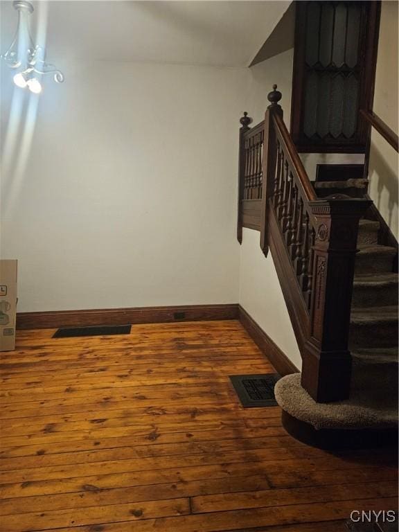 stairway featuring hardwood / wood-style flooring