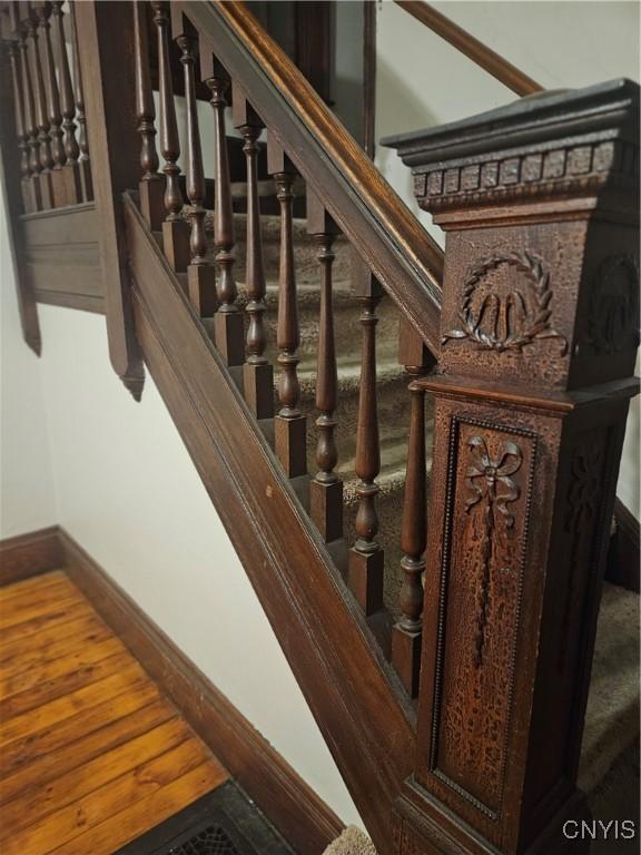 stairway featuring hardwood / wood-style floors