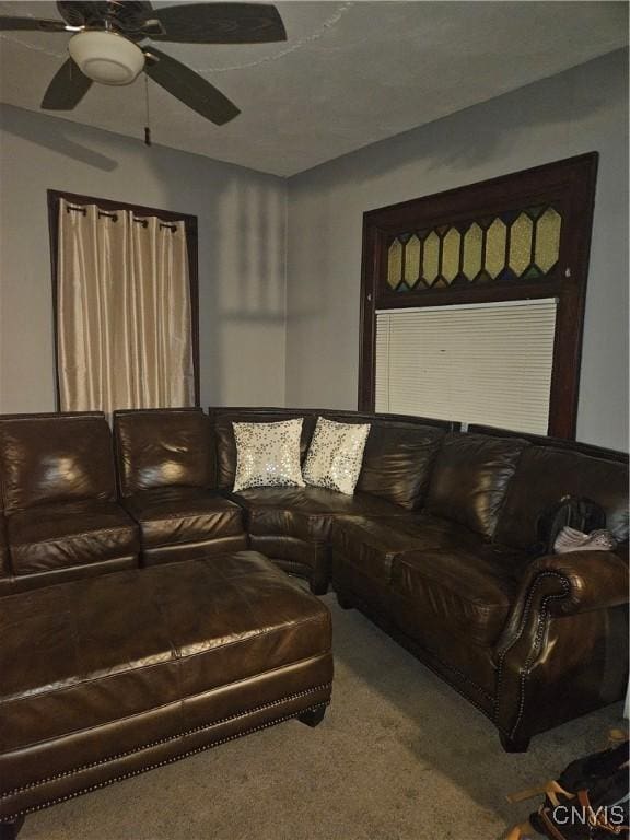 living room featuring ceiling fan and carpet floors